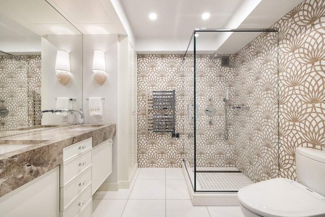 200 E 66th St Unit B1405, New York City, NY 10065 - bathroom with tile patterned flooring, double vanity, toilet, a sink, and a stall shower