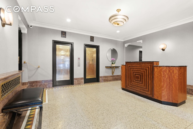 reception area featuring ornamental molding and recessed lighting