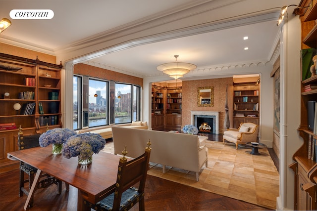 1 E End Ave Unit 8/9B, New York City, NY 10075 - dining room featuring a high end fireplace, ornamental molding, built in shelves, and baseboards