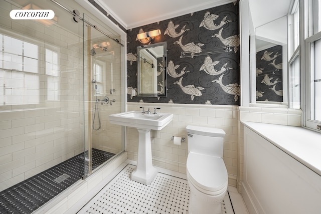 1 E End Ave Unit 8/9B, New York City, NY 10075 - full bath with a stall shower, toilet, a wainscoted wall, ornamental molding, and tile walls
