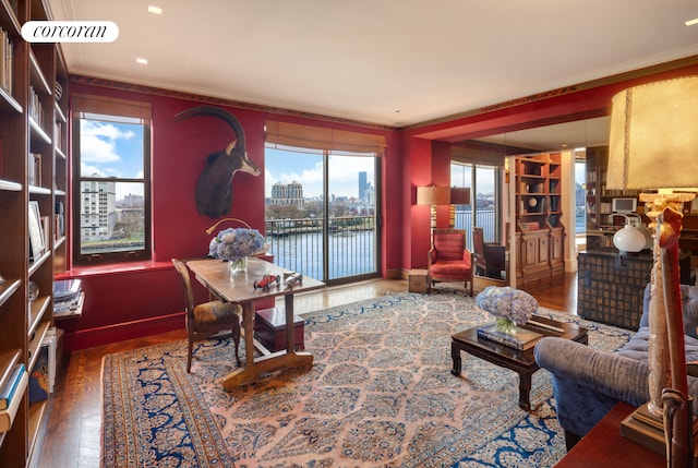 1 E End Ave Unit 8/9B, New York City, NY 10075 - office space featuring ornamental molding, wood finished floors, baseboards, and a city view