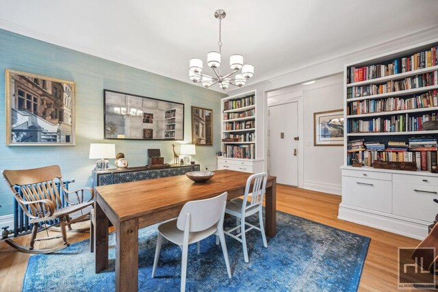 311 W 97th St Unit 3N, New York City, NY 10025 - dining area featuring a chandelier, light wood-style flooring, built in features, and baseboards