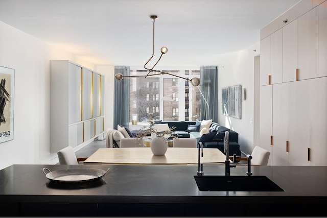 545 W 110th St Unit 6Eg, New York City, NY 10025 - dining area featuring a chandelier