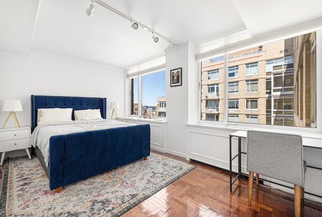 bedroom featuring track lighting