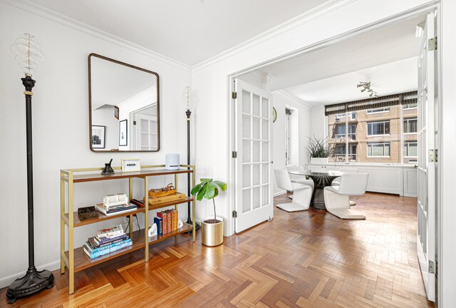 hallway with baseboards and ornamental molding