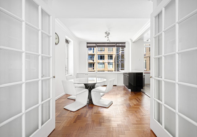 unfurnished dining area with crown molding