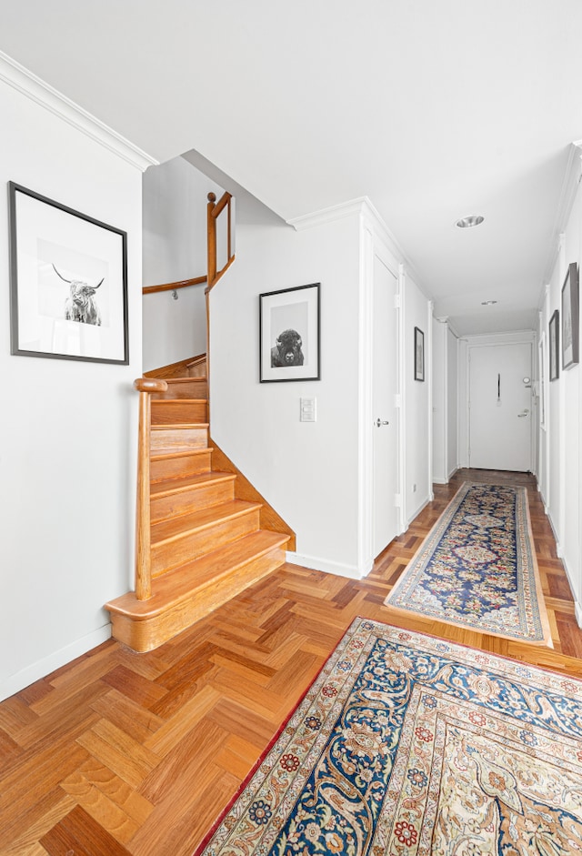 corridor with baseboards and stairway