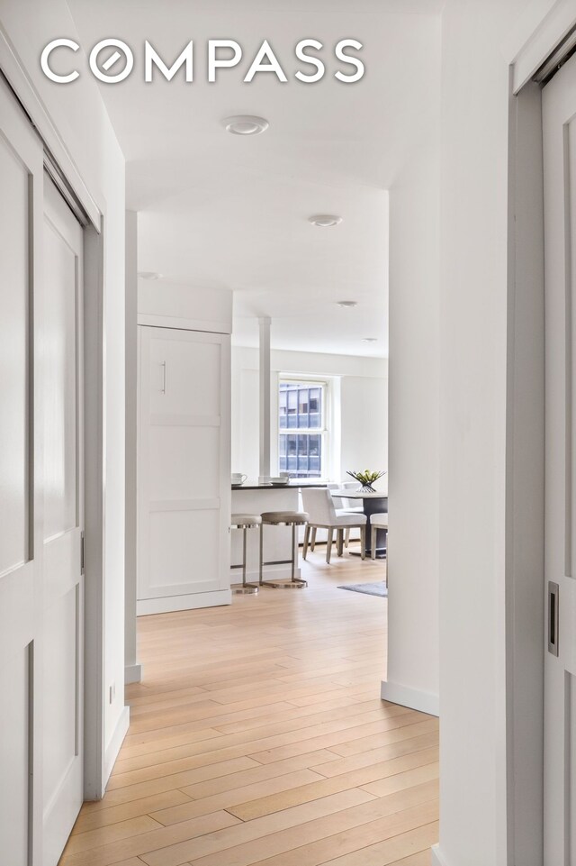 159 W 53rd St Unit 34E, New York City, NY 10019 - office area featuring wine cooler and light wood finished floors