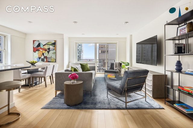159 W 53rd St Unit 34E, New York City, NY 10019 - living area featuring wood finished floors