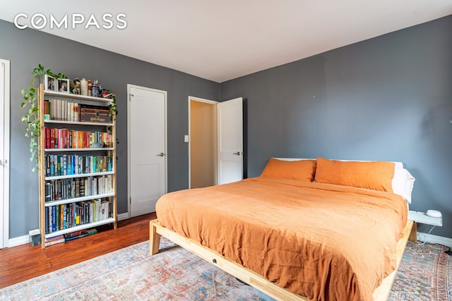 191 Willoughby St Unit 8J, New York City, NY 11201 - bedroom featuring wood finished floors and baseboards