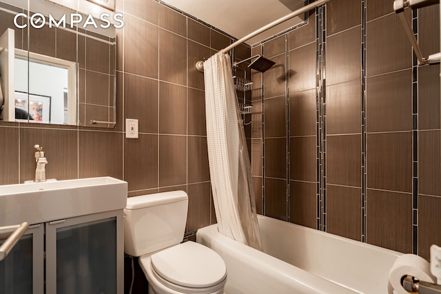 191 Willoughby St Unit 8J, New York City, NY 11201 - bathroom with tile walls, toilet, shower / tub combo, and vanity