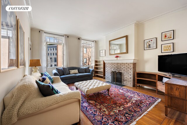 168 Waverly Place Upper, New York City, NY 10014 - living area with wood finished floors, ornamental molding, and a fireplace