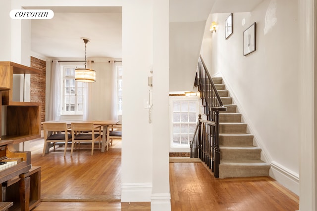 168 Waverly Place Upper, New York City, NY 10014 - staircase featuring plenty of natural light and hardwood / wood-style floors