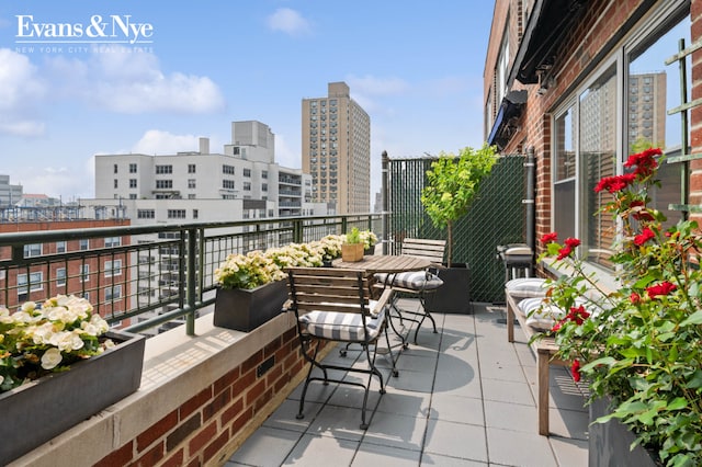 balcony featuring a city view