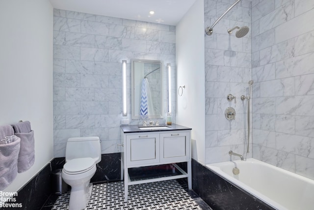 full bath with toilet, vanity,  shower combination, recessed lighting, and tile walls