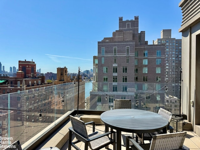 balcony featuring a skyline view