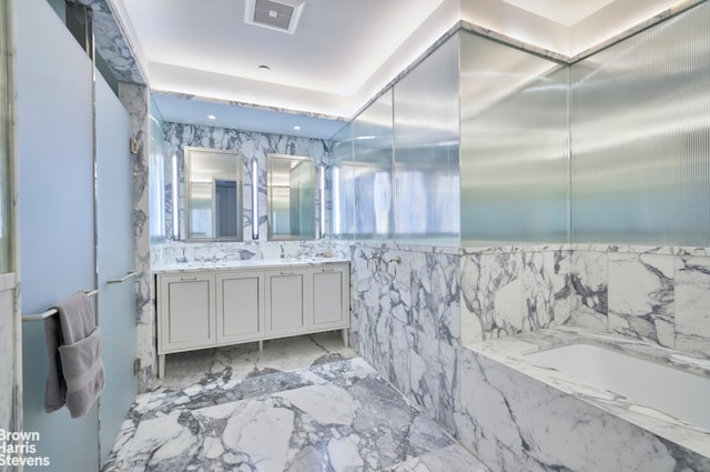 full bathroom with double vanity and a garden tub