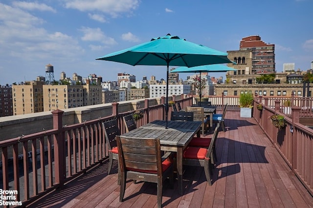 219 W 81st St Unit 6A, New York City, NY 10024 - wooden deck featuring outdoor dining space and a city view