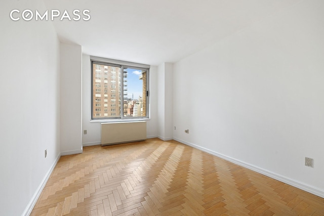 170 E 87th St Unit W15H, New York City, NY 10128 - spare room featuring baseboards