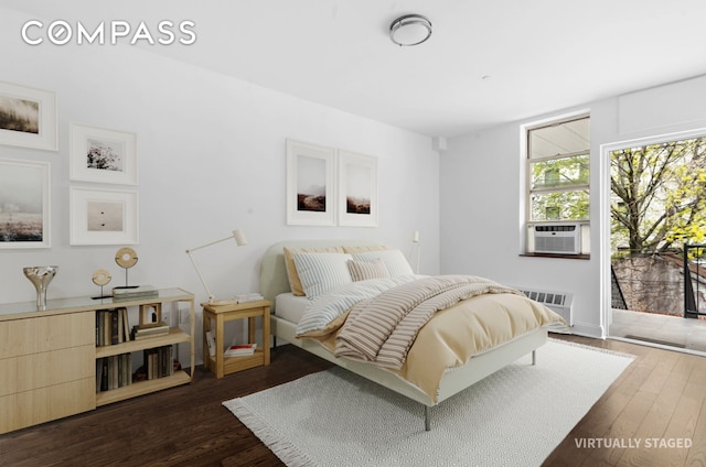 bedroom with access to outside, dark wood finished floors, and cooling unit