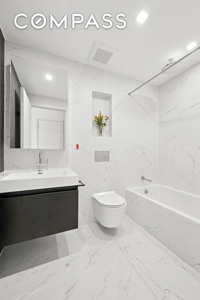 full bathroom with a combined bath / shower with rainfall shower, tile walls, vanity, toilet, and marble finish floor