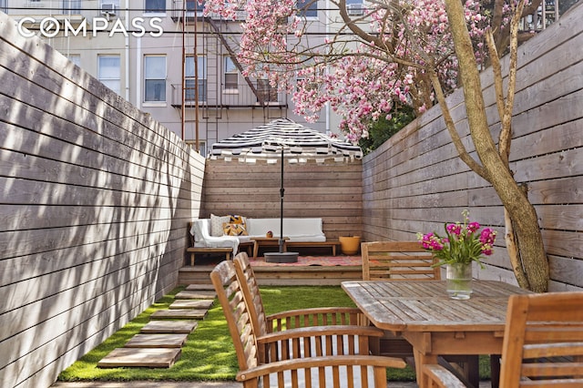 171 Monitor St, New York City, NY 11222 - fenced backyard with outdoor dining space