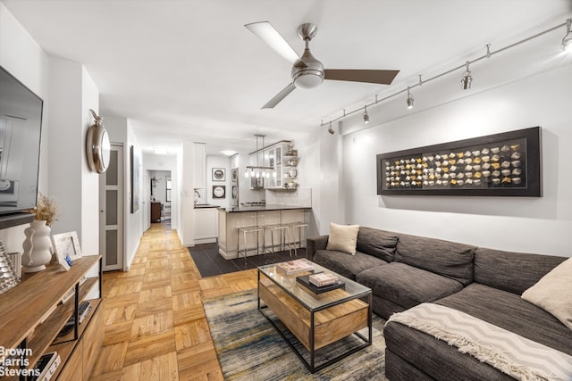 220 E 54th St Unit 8D, New York City, NY 10022 - living room featuring a ceiling fan and rail lighting