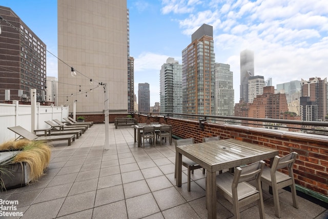 220 E 54th St Unit 8D, New York City, NY 10022 - view of patio / terrace with outdoor dining space and a view of skyline
