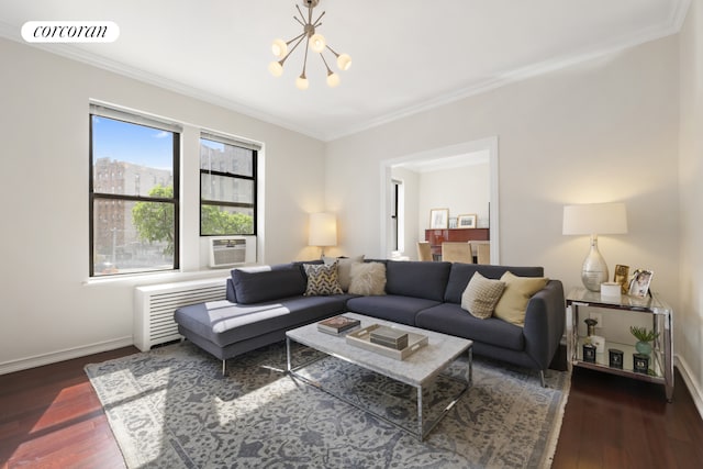living room featuring baseboards, wood finished floors, a chandelier, and ornamental molding