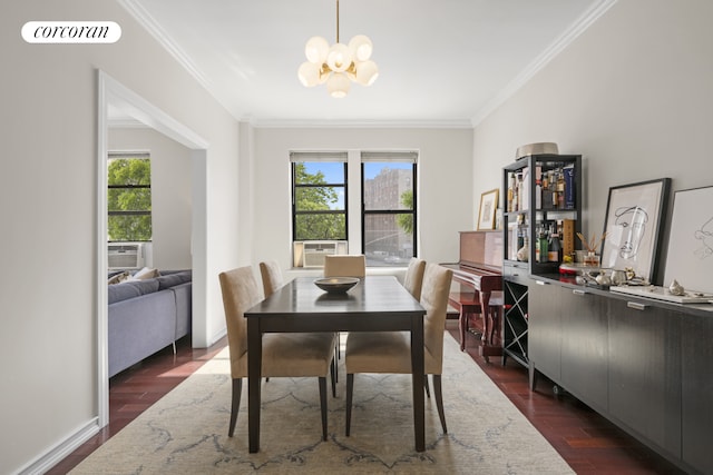 dining area with crown molding, a chandelier, and dark wood-type flooring