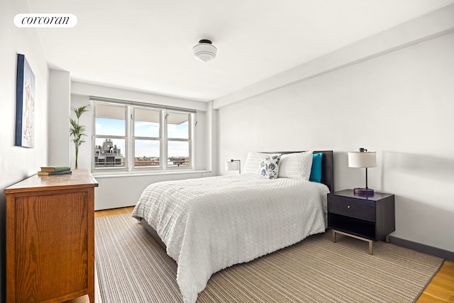 bedroom featuring wood finished floors