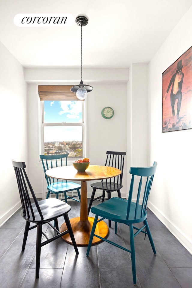 dining area featuring baseboards