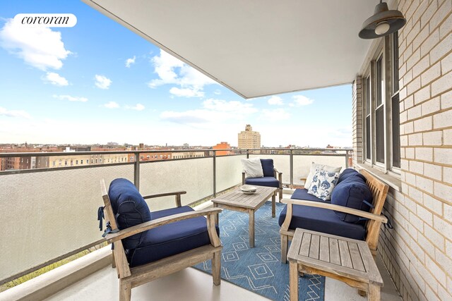 balcony with outdoor lounge area and a view of city