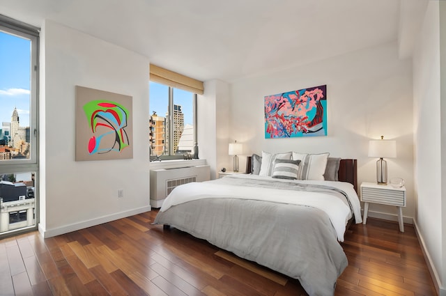 121 E 23rd St Phd, Phd, New York City, NY 10010 - bedroom featuring wood-type flooring and a view of city