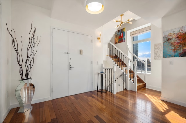 121 E 23rd St Phd, Phd, New York City, NY 10010 - foyer featuring hardwood / wood-style flooring, stairs, and a chandelier