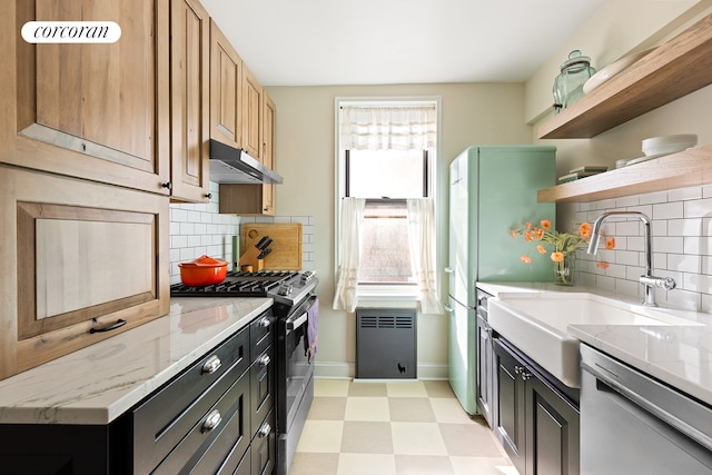 kitchen with stainless steel appliances, under cabinet range hood, radiator, open shelves, and baseboards