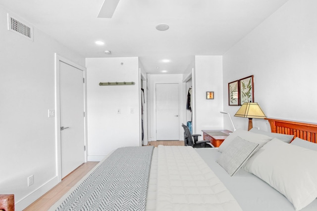 bedroom with recessed lighting, visible vents, and light wood-type flooring
