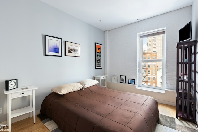 bedroom with wood finished floors