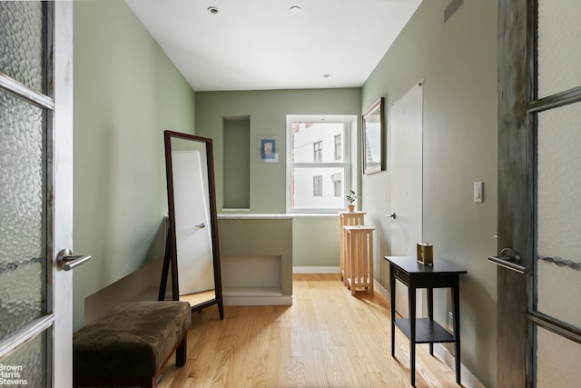 living area featuring wood finished floors and baseboards