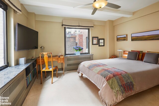 50 Park Ave Unit 5B, New York City, NY 10016 - bedroom featuring light colored carpet, ceiling fan, and beamed ceiling
