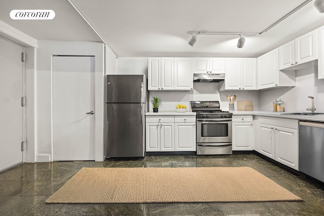 50 Bridge St Unit 501, New York City, NY 11201 - kitchen featuring appliances with stainless steel finishes, a sink, under cabinet range hood, white cabinets, and light countertops
