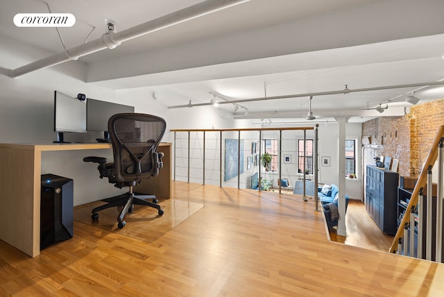 50 Bridge St Unit 501, New York City, NY 11201 - office area with track lighting, wood finished floors, and brick wall