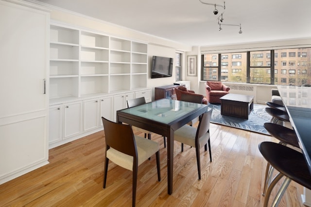 dining space with light wood-style floors