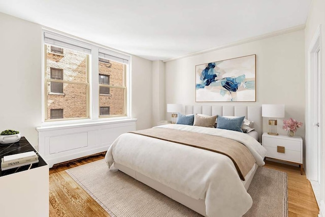 bedroom featuring light wood-style floors