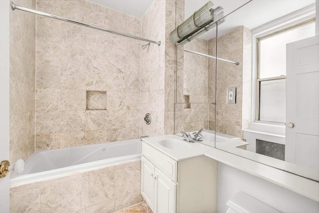 bathroom with vanity and tiled shower / bath combo