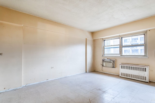 609 Columbus Ave Unit 4A, New York City, NY 10024 - empty room with tile patterned floors, radiator heating unit, and a wall mounted air conditioner