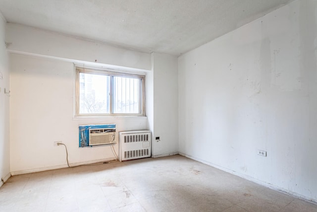 609 Columbus Ave Unit 4A, New York City, NY 10024 - unfurnished room featuring radiator heating unit and a wall mounted AC
