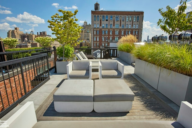 view of home's community featuring a view of city and an outdoor hangout area