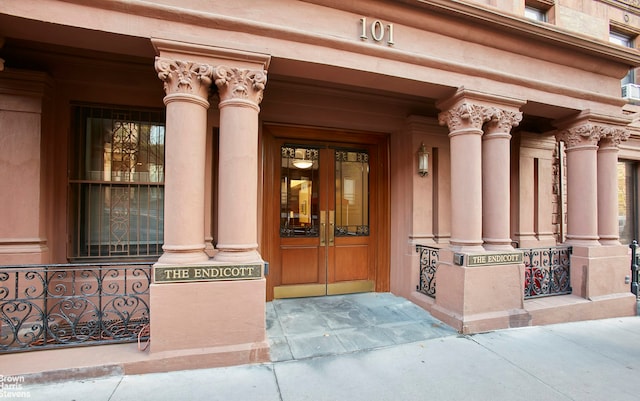 view of exterior entry with covered porch