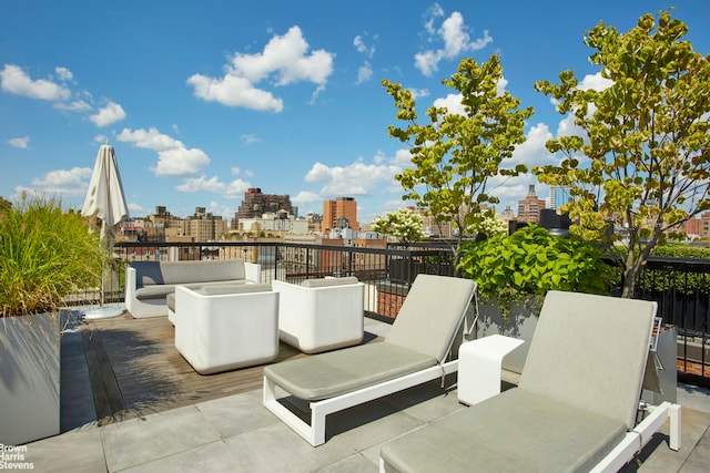 view of patio with a city view and an outdoor living space